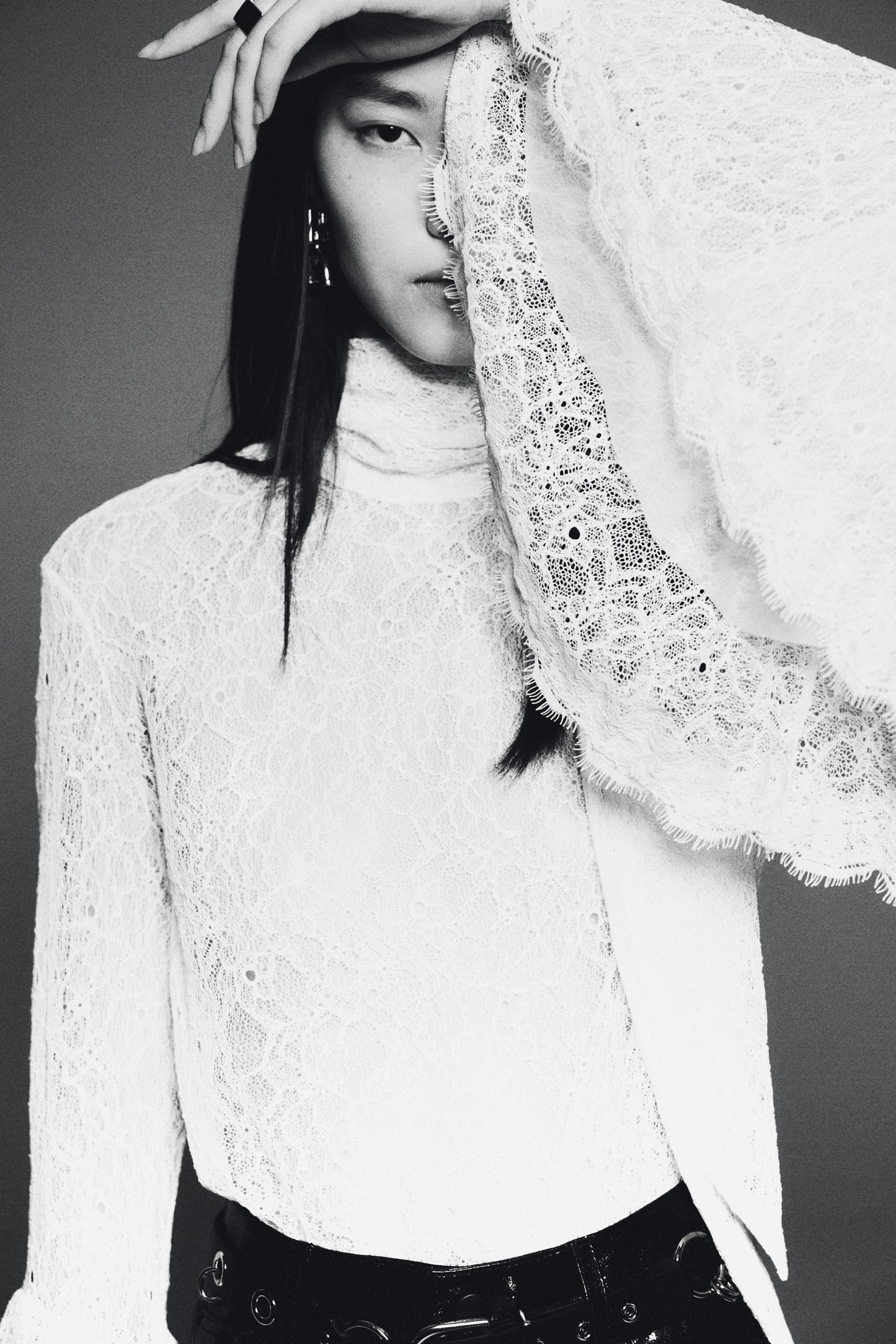 Trumpet-sleeved lace blouse