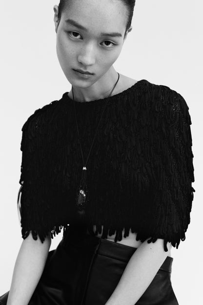 Fringed rib-knit cape