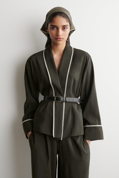 Contrast-piped belted wrap top